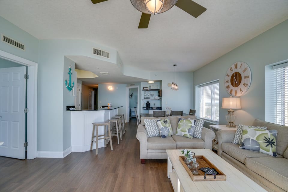 Relax in your bright, open living space with coastal decor and a kitchen perfect for preparing meals together.