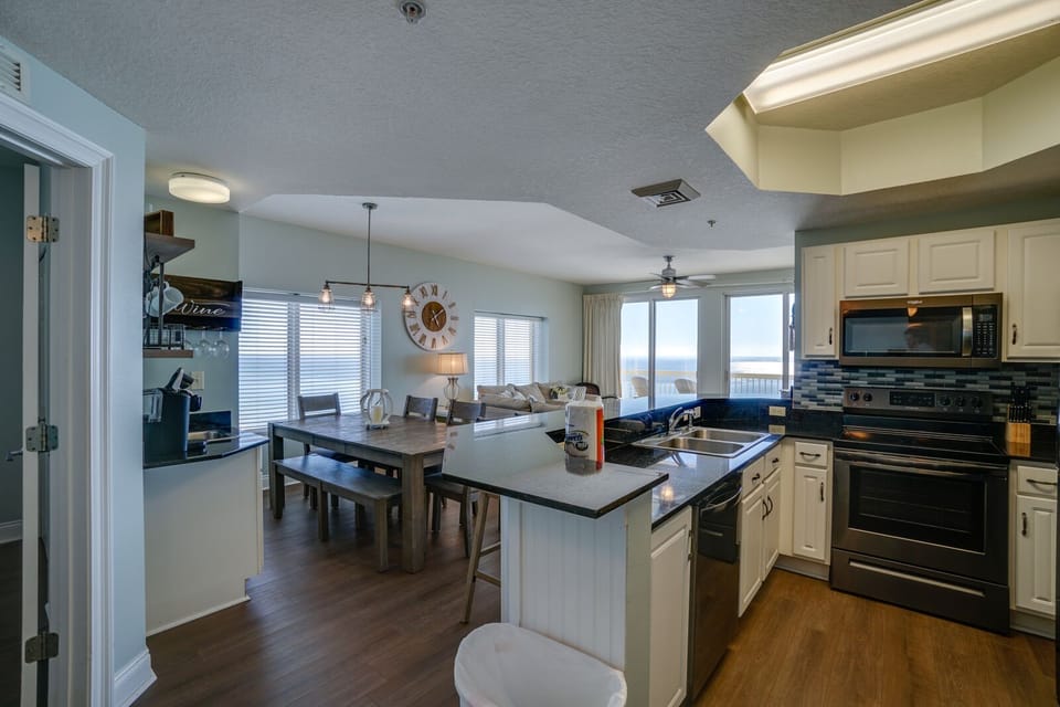 Your spacious open-concept kitchen flows seamlessly into the dining and living areas, where you can cook, dine, and relax while enjoying stunning ocean views.