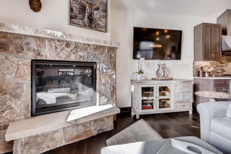 Gas fireplace lights with just the turn of a switch. Cabinet has WiFi modem.