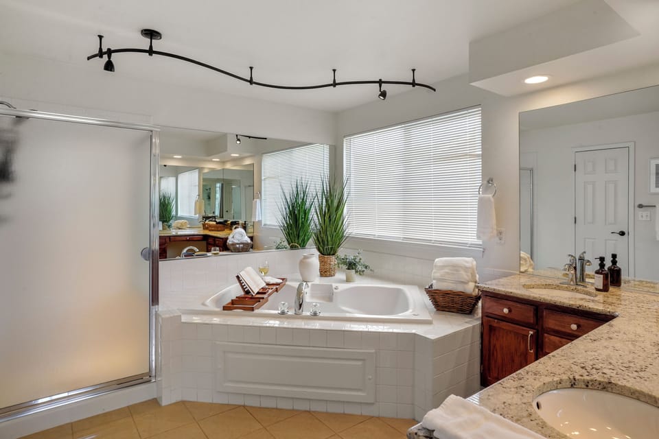 Primary Bathroom shower and jetted tub, dual sinks.