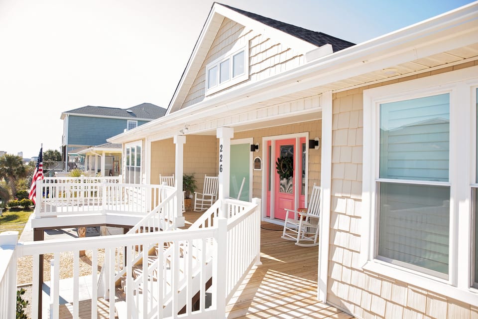 Front porch area with two large decks and multiple rocking chairs to enjoy!