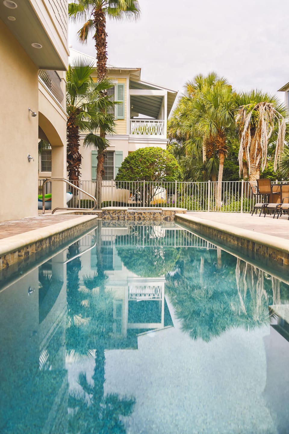 Custom pool, hot tub, tanning ledge, oversized patio and outdoor grill.