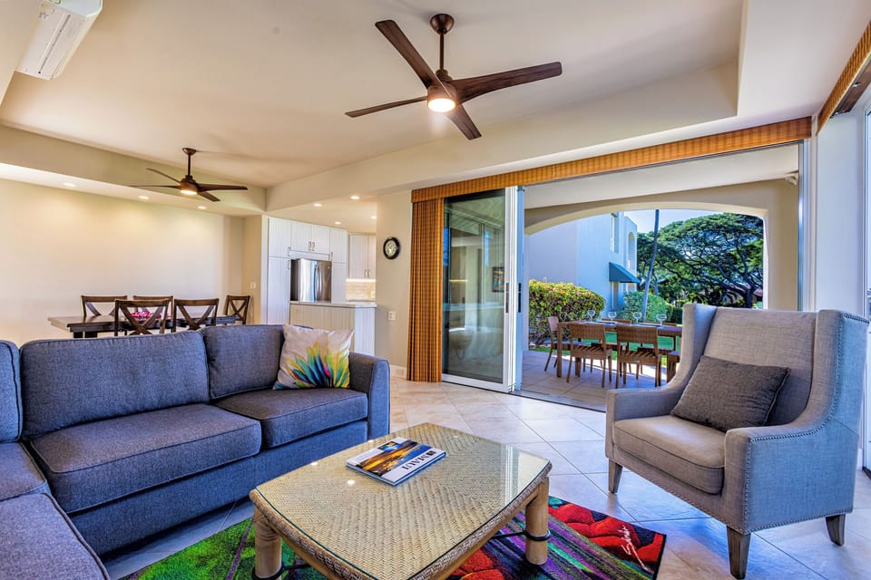 Looking from the living room TV direction kitchen with the wrap-around lanai to the right