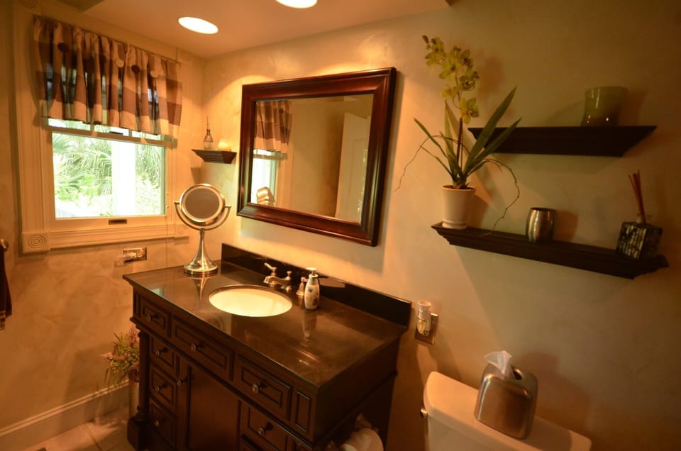 Beautifully decorated master bathroom with double shower.