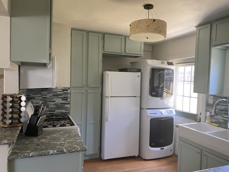 Well stocked kitchen with full size washer and dryer.