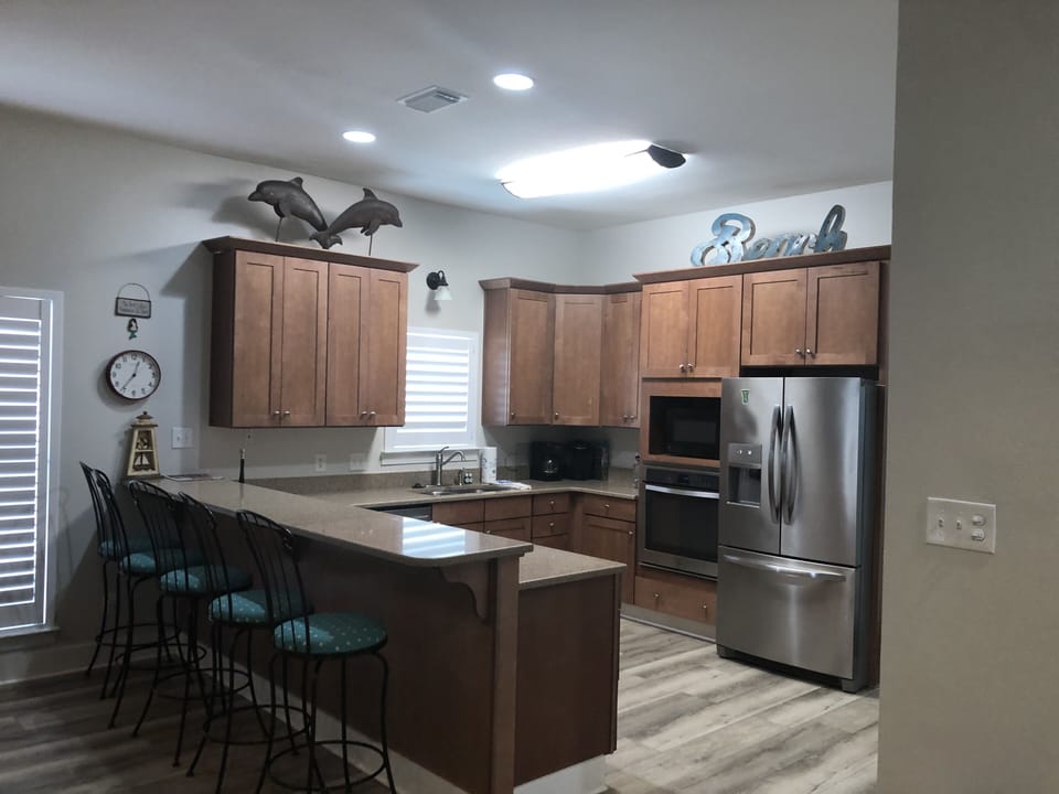 Kitchen includes 25' refrigerator, range, oven, and two dishwashers.