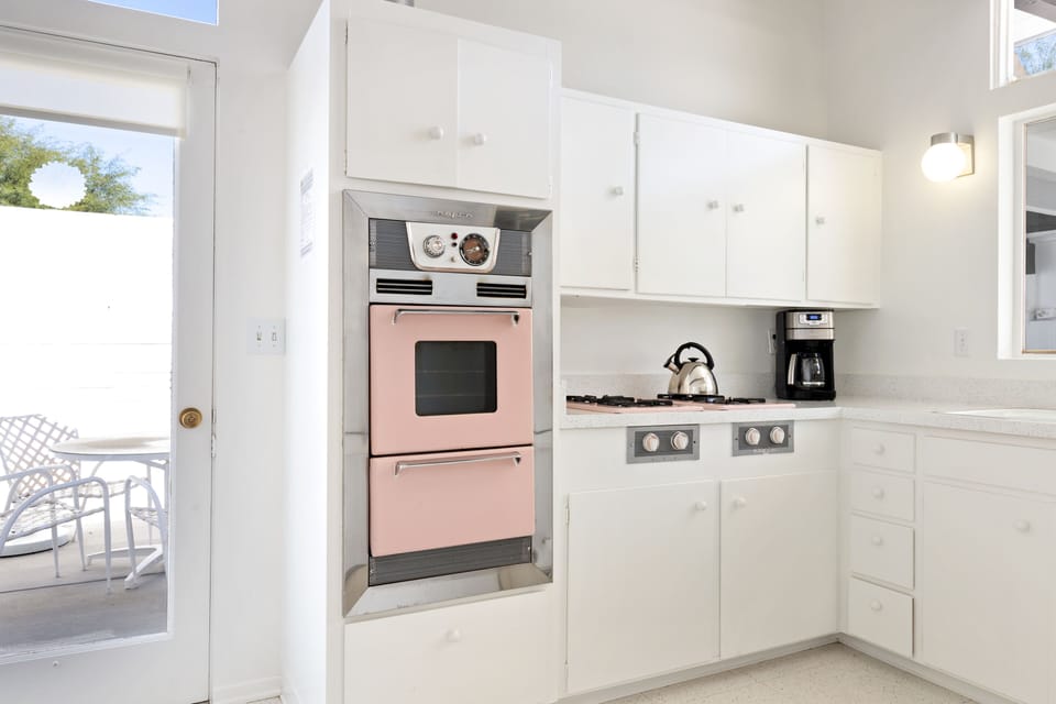 Classic mid-century modern pink and chrome appliances.