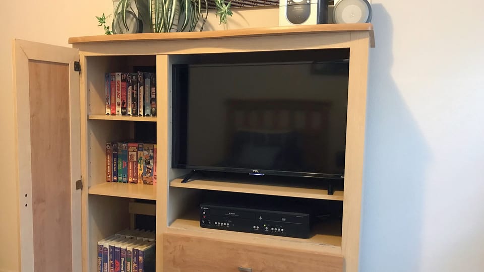 ... AND a brand new (Nov/17) 32" TV with VCR/DVD player, stereo & video library!