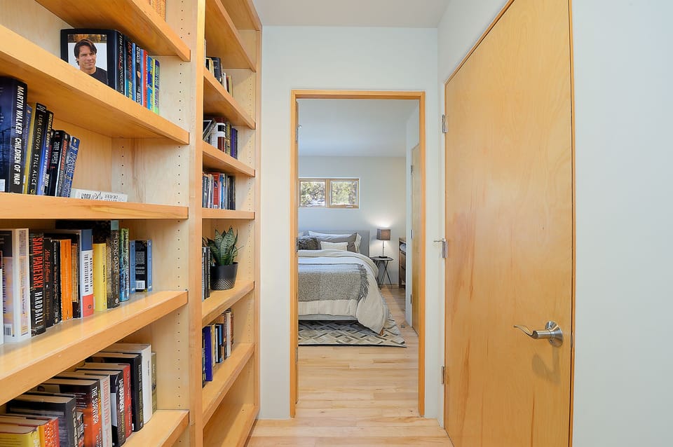 Extensive library and handy  laundry center tucked into closet
