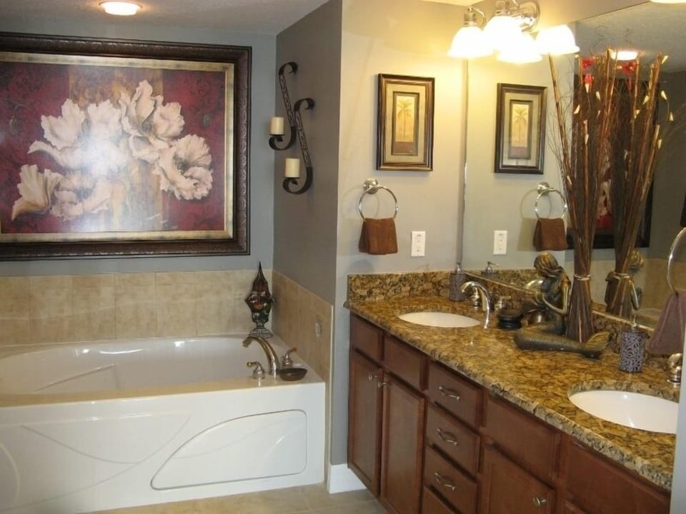 Mstr Bathroom with Large Jacuzzi Tub, Walk in Tiled Shower and Commode Closet