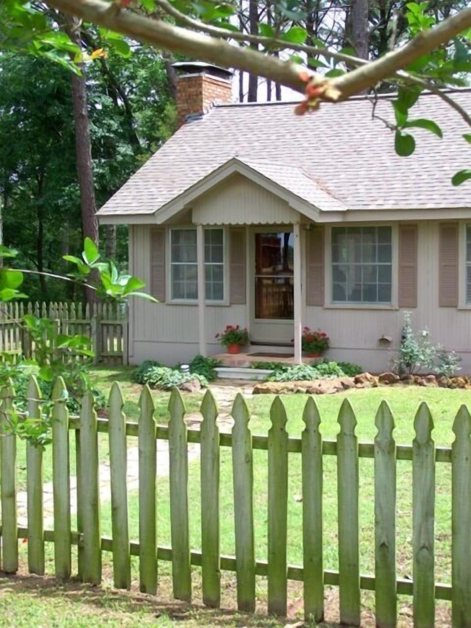 Pine Grove Cottage sheltered in a grove of tall pines and beautiful hardwoods.
