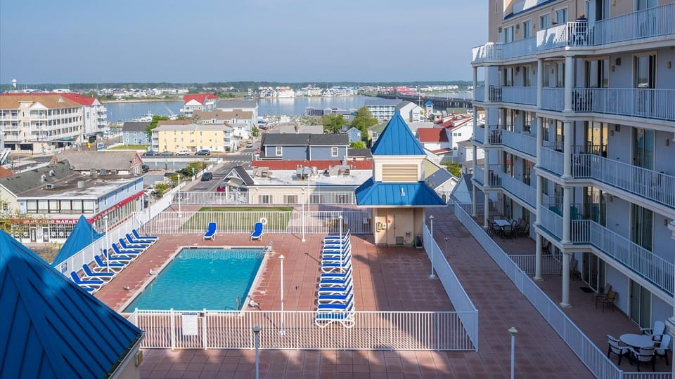 pool deck area with putting green