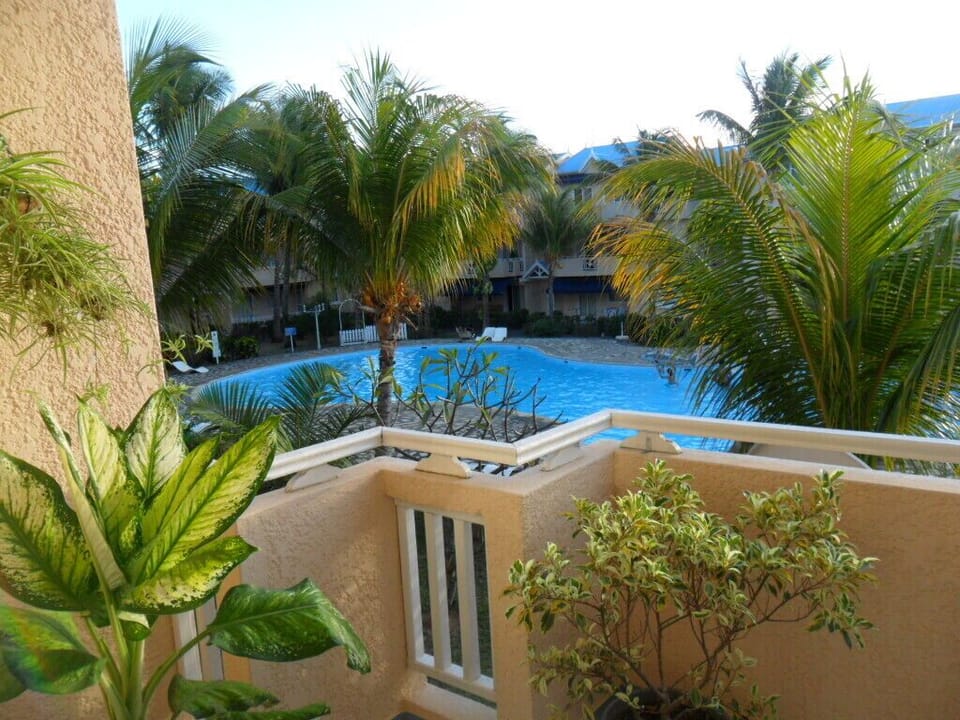 Balcony overlooking pool & garden