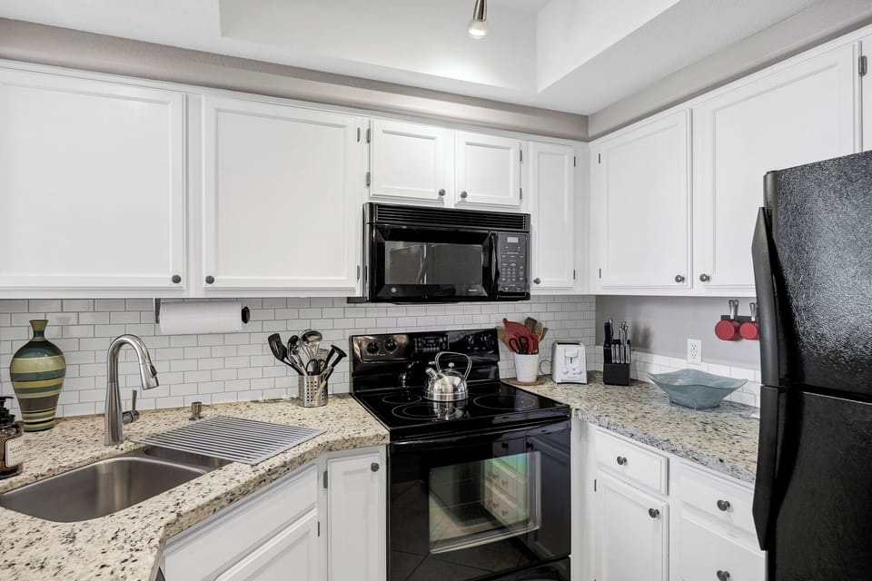 Crock pot, toaster oven, mini chopper, muffin and pizza pans in the cupboards.