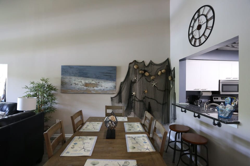 Spacious dining for 6 with Blue Pearl granite breakfast serving bar