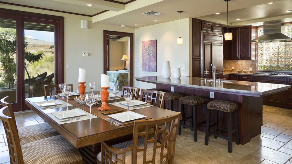Dining for eight using pull up seating, as well as at the peninsula bar