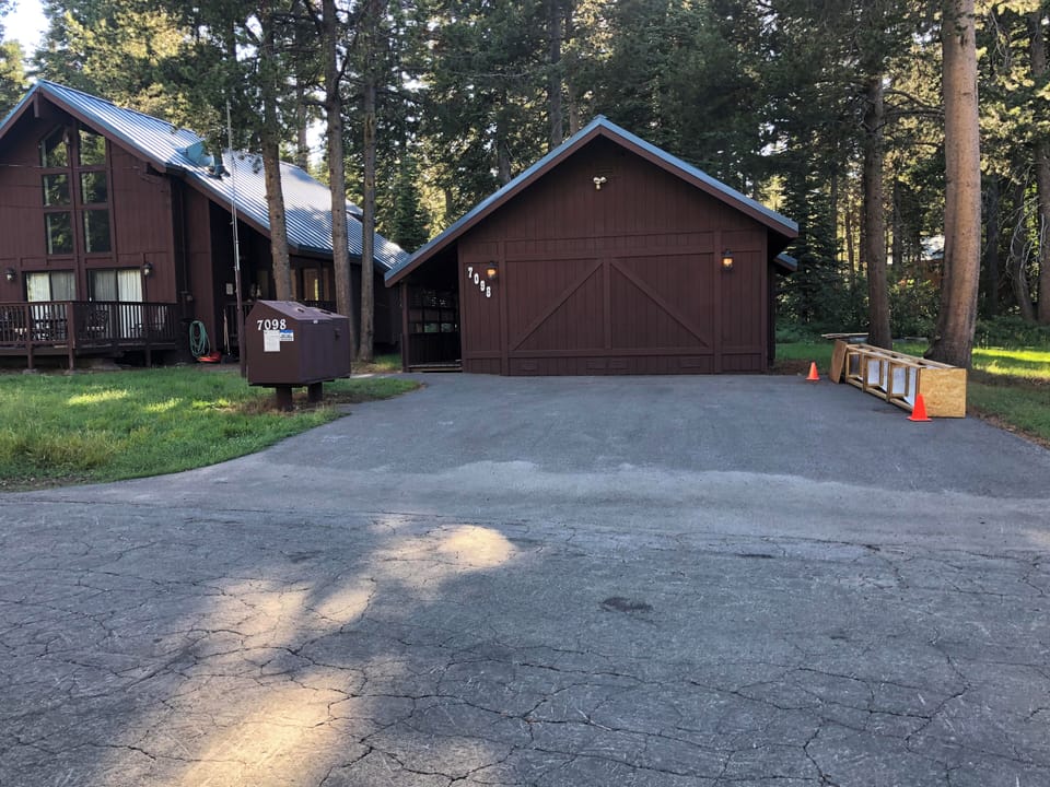 Our driveway starts at the curve. The main cabin is to your left
