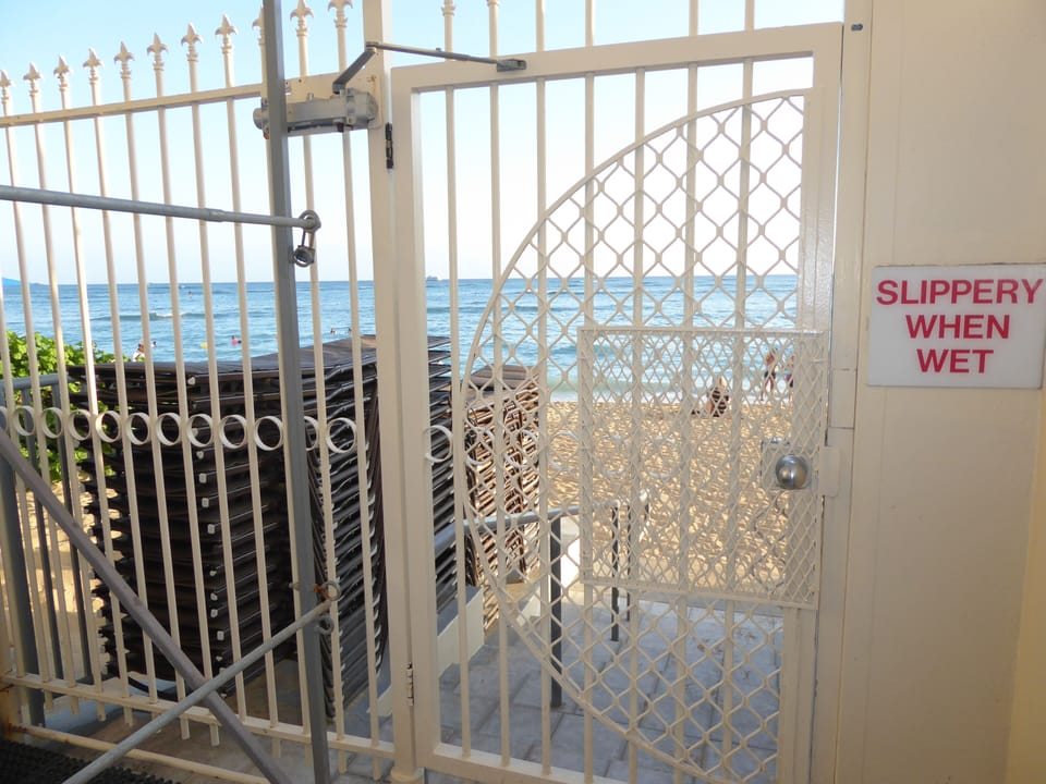 Rear gate leading directly onto Waikiki Beach