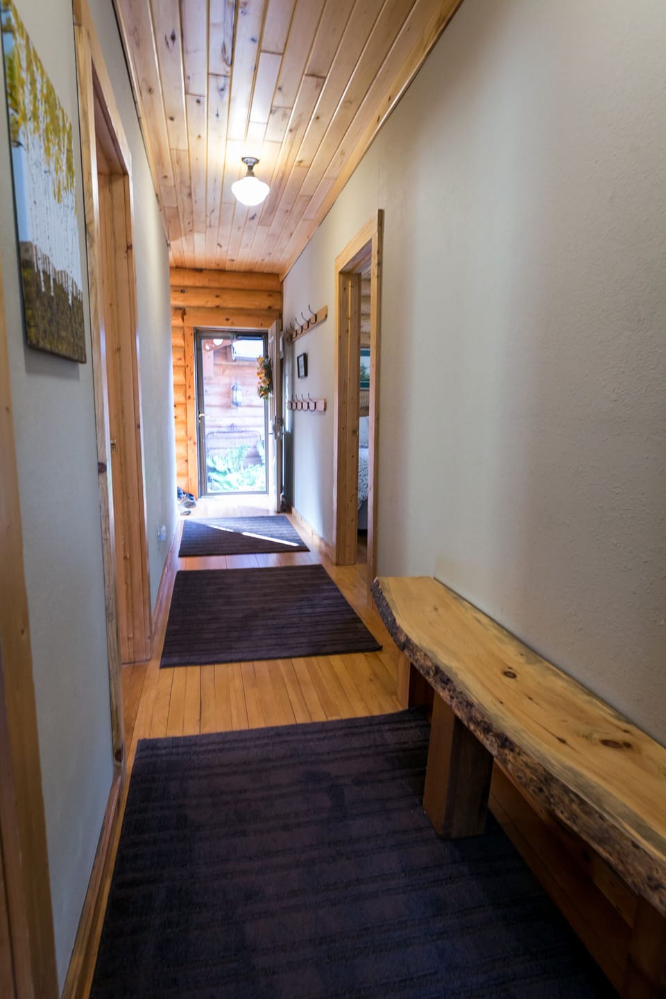 A look from the bathroom back down the hall to the entry.