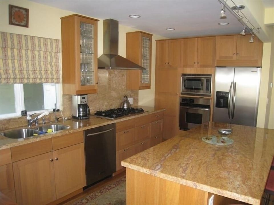 Kitchen with granite countertops and stainless steel appliances