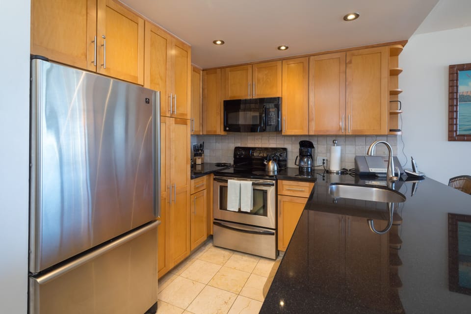 Full-size refrigerator, stove, dishwasher, and microwave.