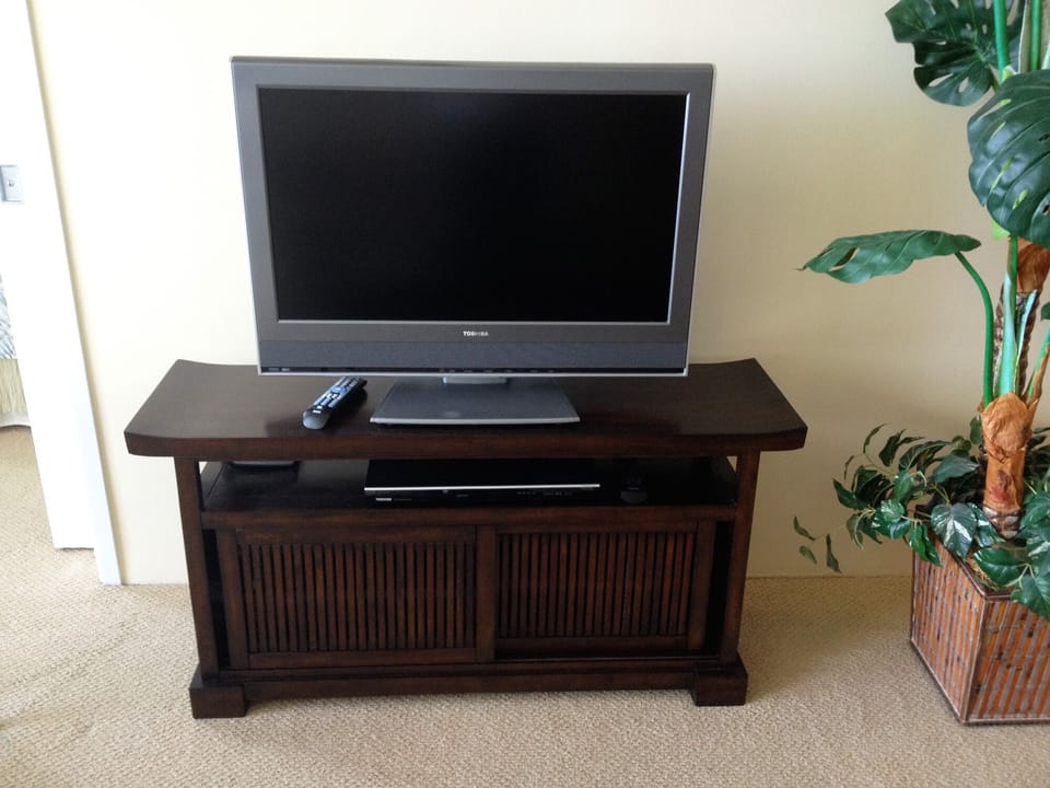 43" TV and DVD player with DVDs of movies and TV shows filmed on Oahu.