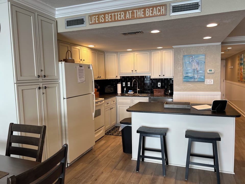 Fully stocked kitchen with seating for two