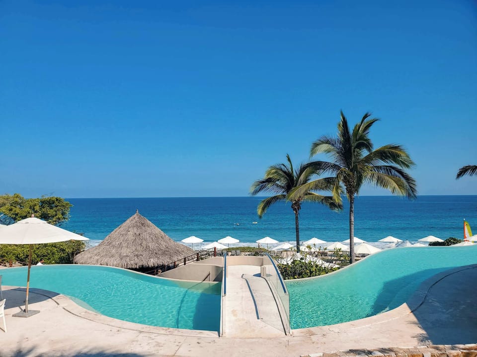 Relax by the pool with an ocean backdrop, the perfect spot to cool off on the Kupury Beach Club.