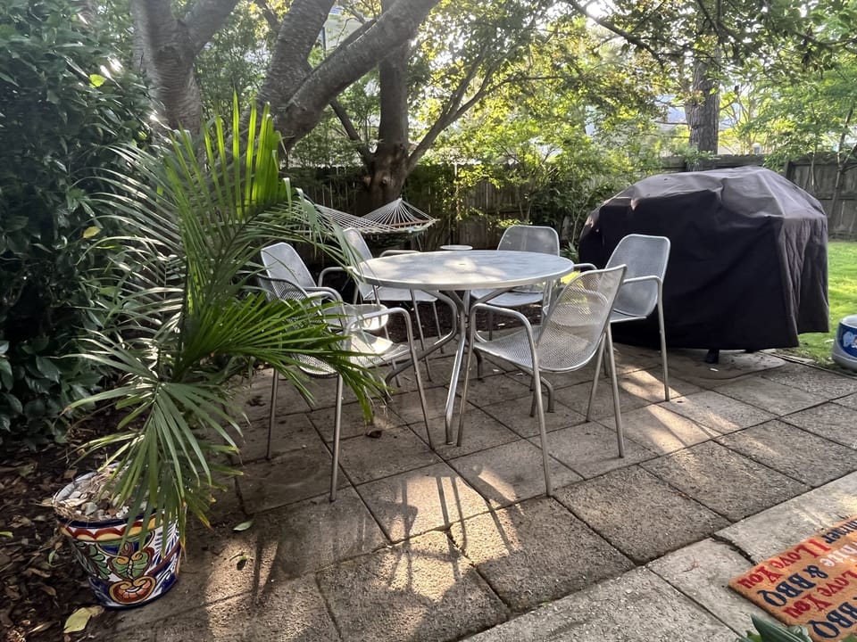 Cooling shade, a rarity in Rehoboth. Enjoy the hammock, chaise, patio, & BBQ.