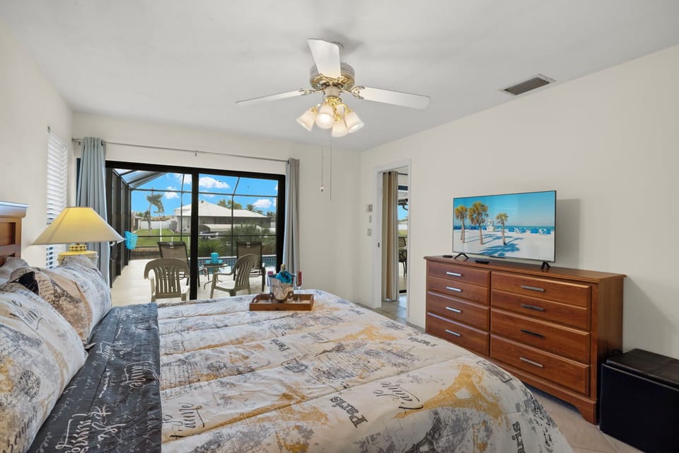 A king bed and private sliders to the pool make the primary suite an easy, comfortable retreat at the end of the day.