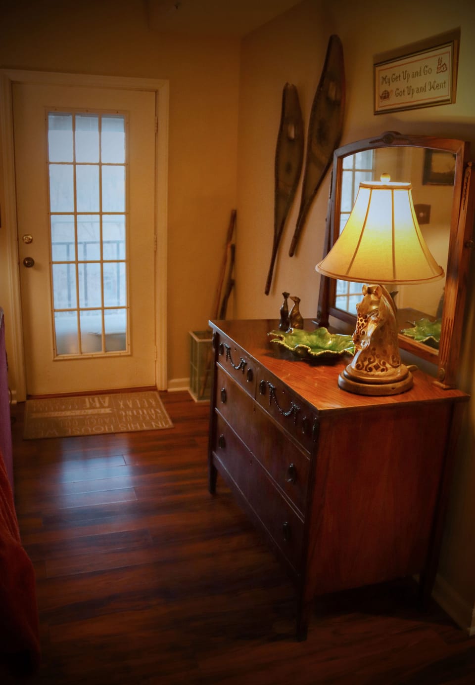 The front door connects the living room to the large front porch.