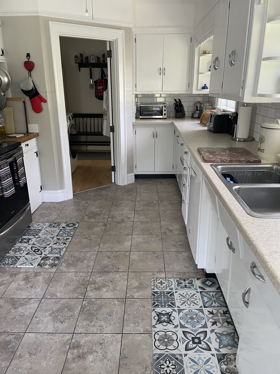 Kitchen, with doorway to master bedroom 
