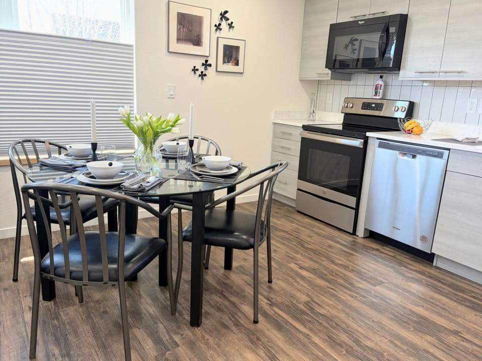 Full Kitchen (stove, microwave, and dishwasher) and dining area