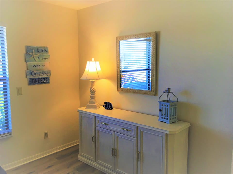 Bedroom #3 has coastal decor, dresser storage and closet