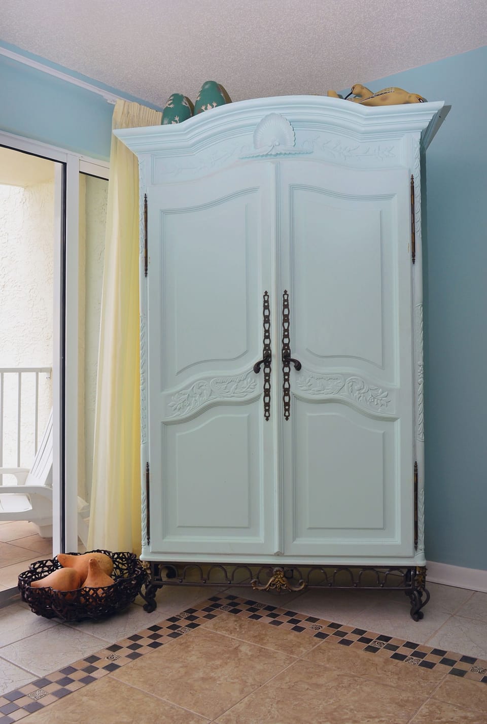 Large flat screen TV in armoire.