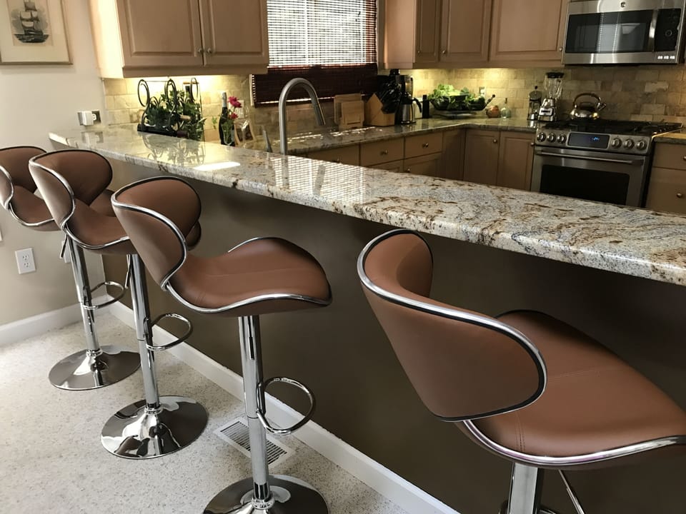 Open kitchen with bar seating