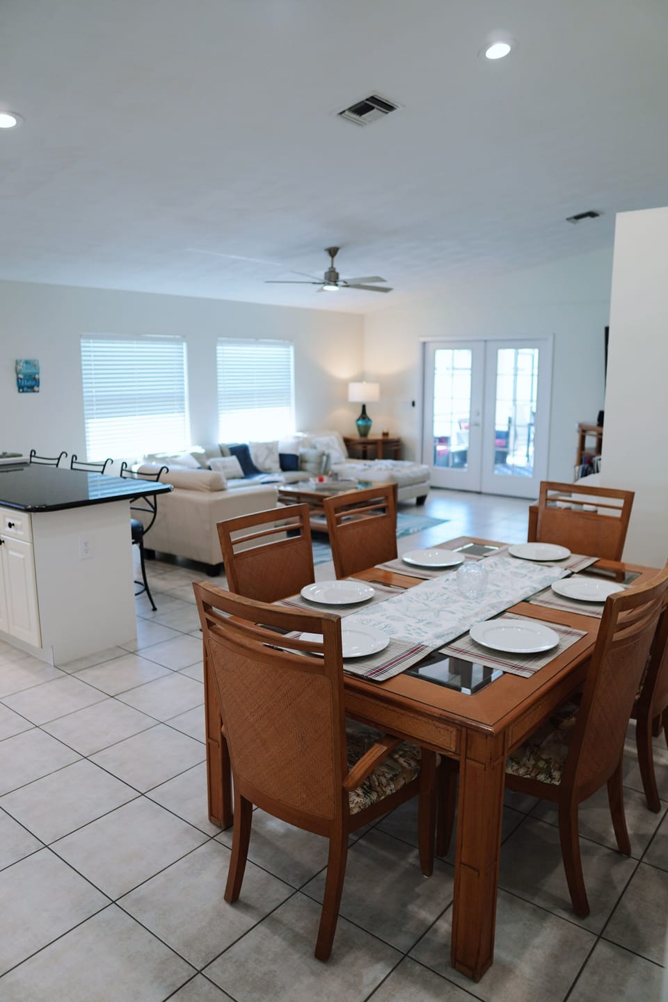 Bright open concept living area with vaulted ceilings