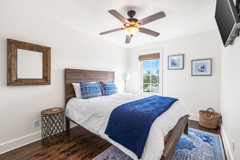 Third floor Guest Queen Bedroom with Flat Screen TV has access to the shared hallway bathroom