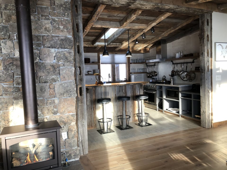 Spacious floor plan for mingling with a cozy gas fireplace for winter ambiance