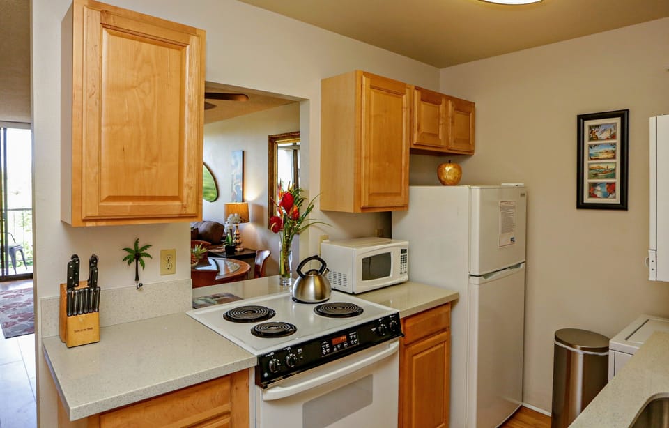 Kitchen with everything you need to cook meals and warm up leftovers.