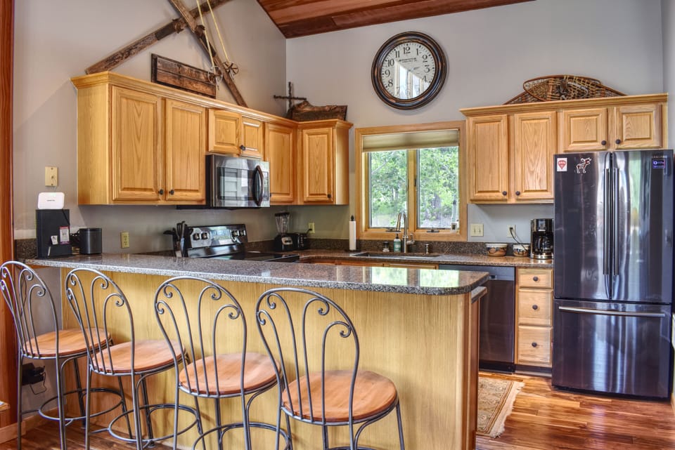 Newly-renovated kitchen with breakfast bar.