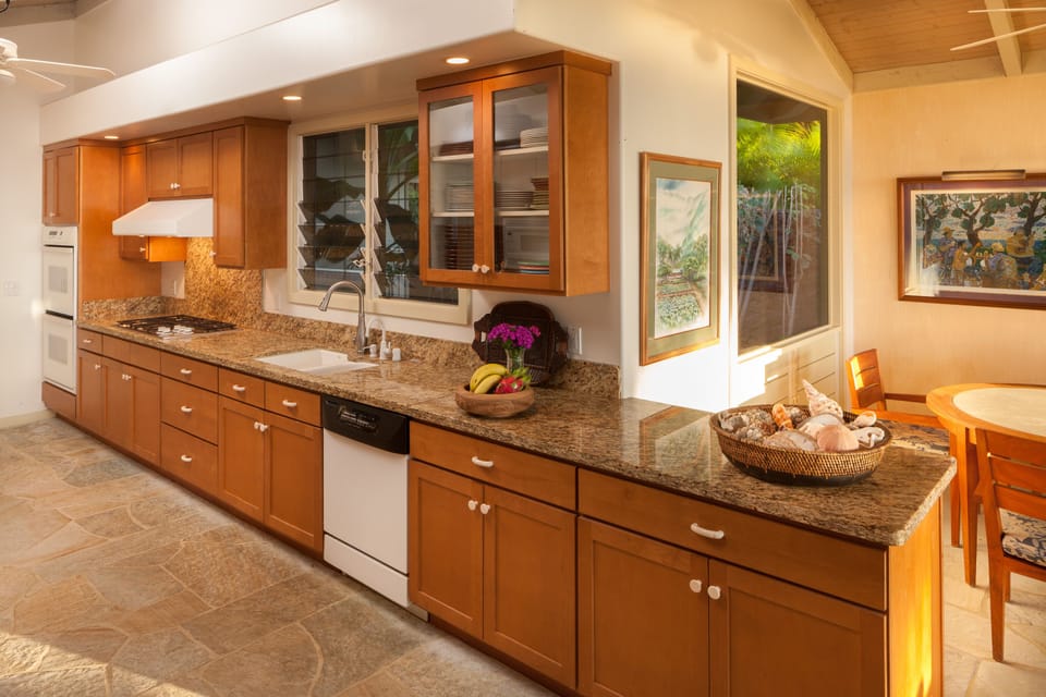 Beautiful granite.  Lots of prep, dining and entertaining ware for great meals.