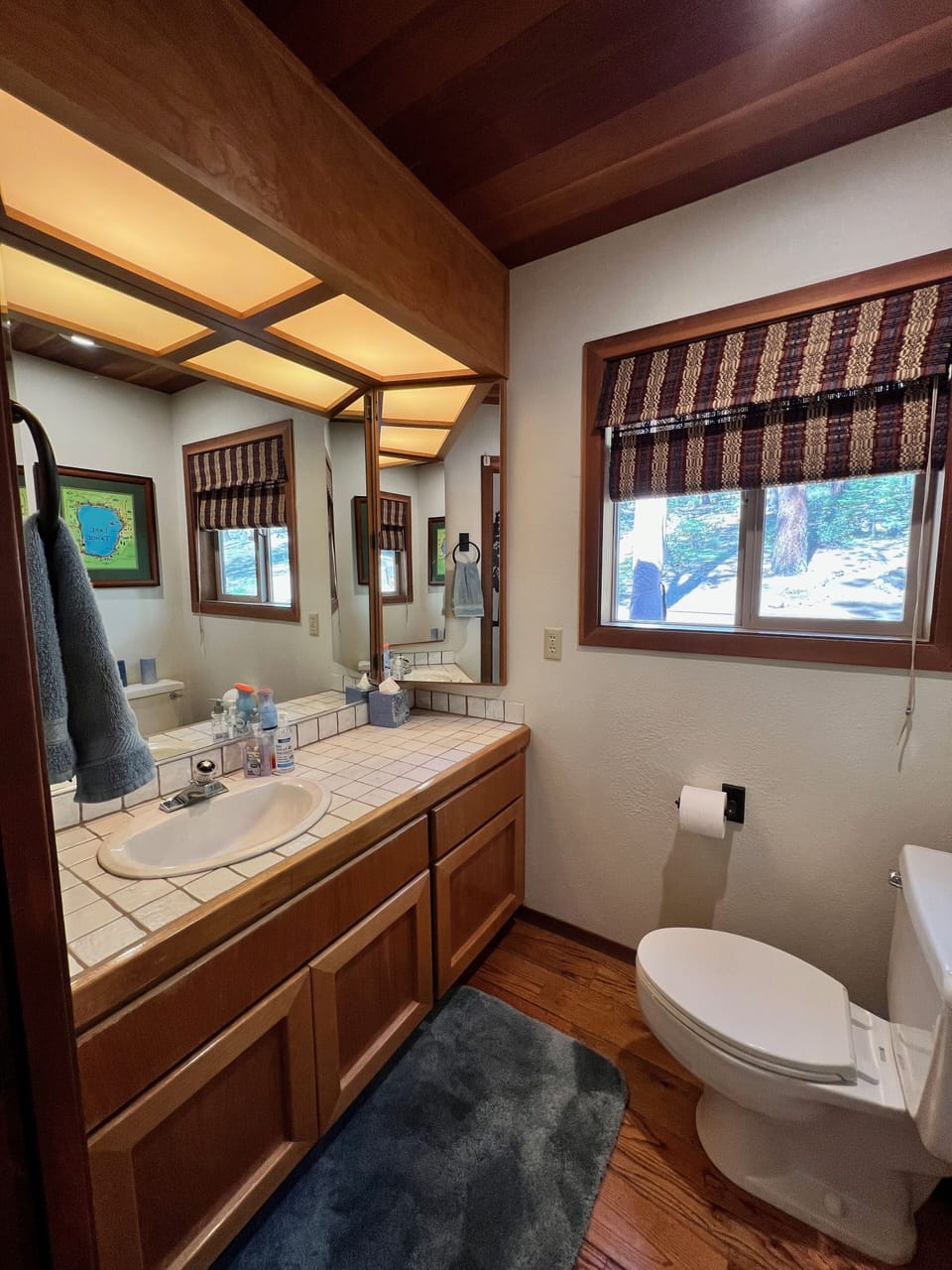 On your left is the primary vanity and toilet. Looks like guest powder room