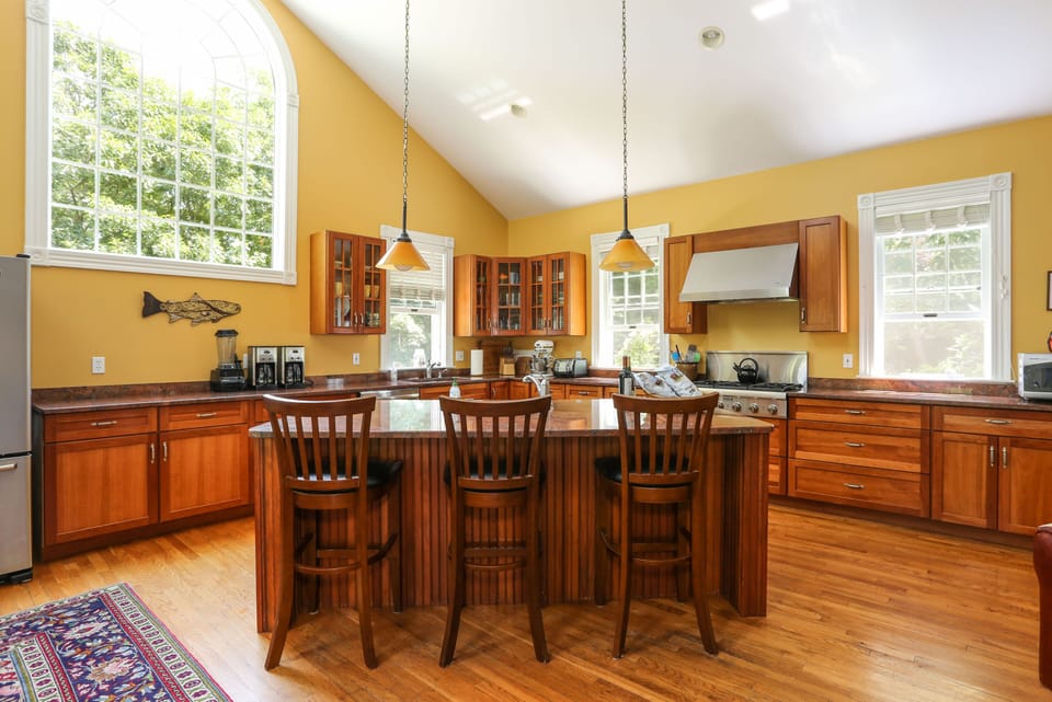 The kitchen island is a popular gathering spot.