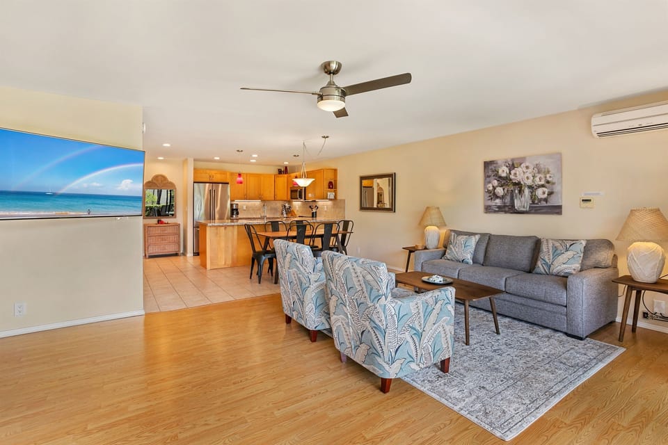 Looking from the oversized living room towards the kitchen. TV, A/C