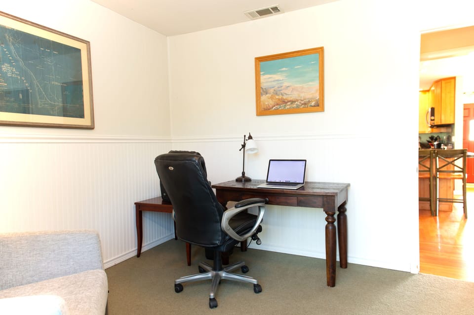 Bedroom/ Office area looking  towards kitchen, WIFI, comfortable Chair & Desk