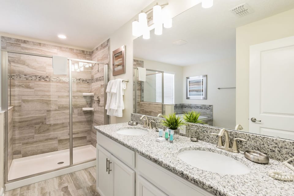 shared bathroom with walk in shower at  The Retreat at ChampionsGate