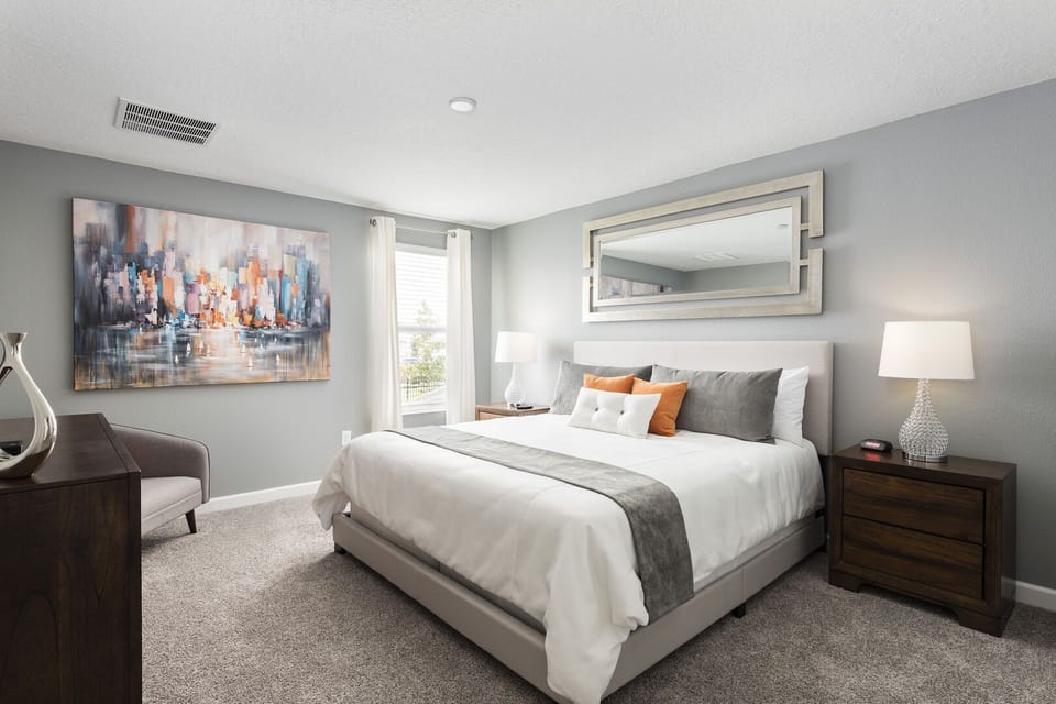 king bedroom with fully floored decorate villa at The Retreat at ChampionsGate