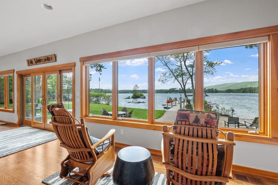 Sunroom overlooking lake and mountain views, great for watching guests on the beach and enjoying the sunsets.