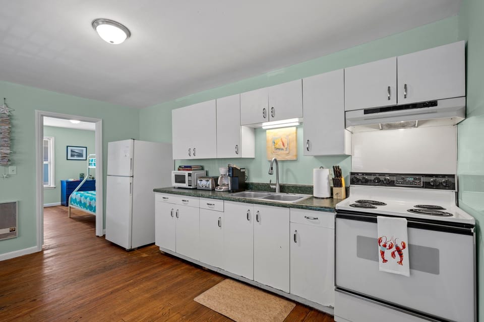 Your fully equipped kitchen features everything needed for home-cooked meals, from morning coffee to family dinners together.